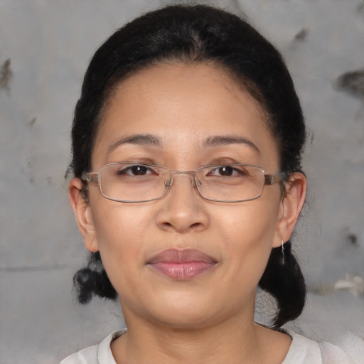 Joyful asian adult female with short  brown hair and brown eyes
