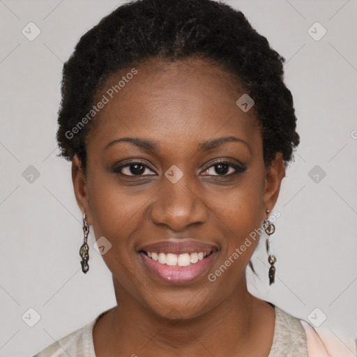 Joyful black young-adult female with short  black hair and brown eyes