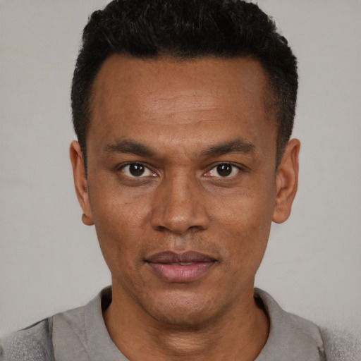 Neutral black young-adult male with short  black hair and brown eyes