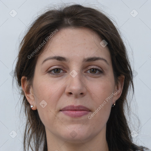 Joyful white adult female with long  brown hair and grey eyes