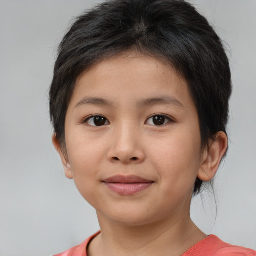 Joyful white child female with short  brown hair and brown eyes