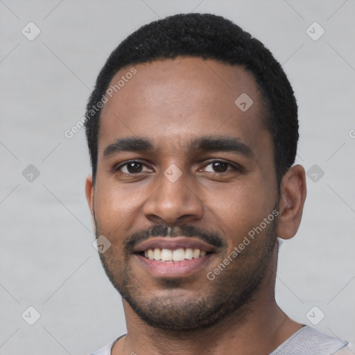 Joyful black young-adult male with short  black hair and brown eyes