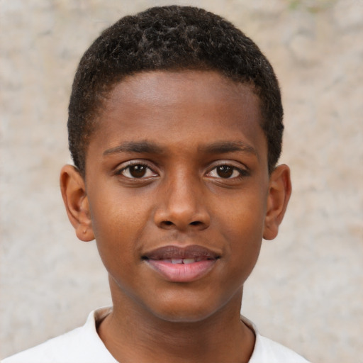 Joyful black child male with short  brown hair and brown eyes