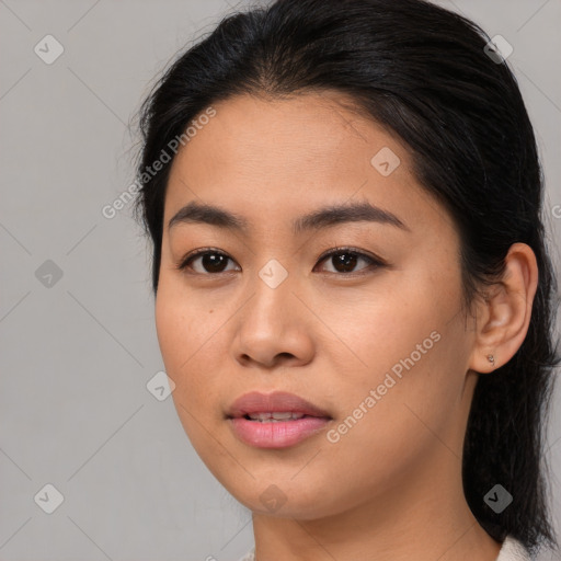 Joyful asian young-adult female with medium  black hair and brown eyes