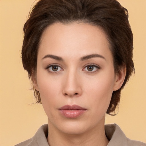 Neutral white young-adult female with medium  brown hair and brown eyes