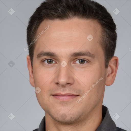 Joyful white adult male with short  brown hair and brown eyes