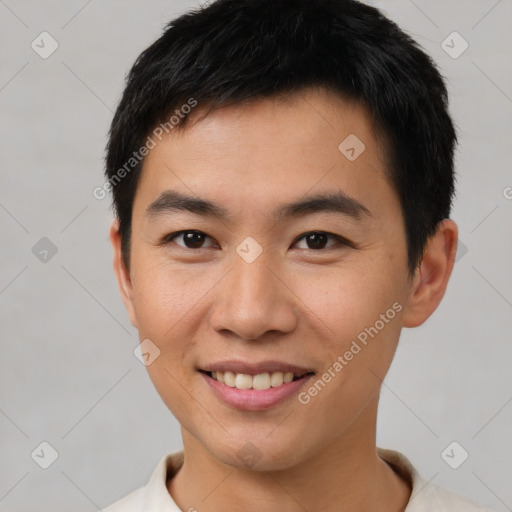 Joyful asian young-adult male with short  brown hair and brown eyes