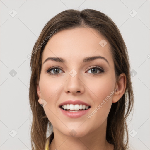 Joyful white young-adult female with long  brown hair and grey eyes