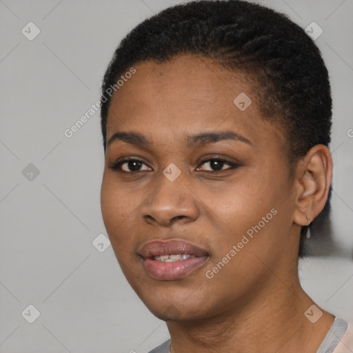 Joyful black young-adult female with short  black hair and brown eyes