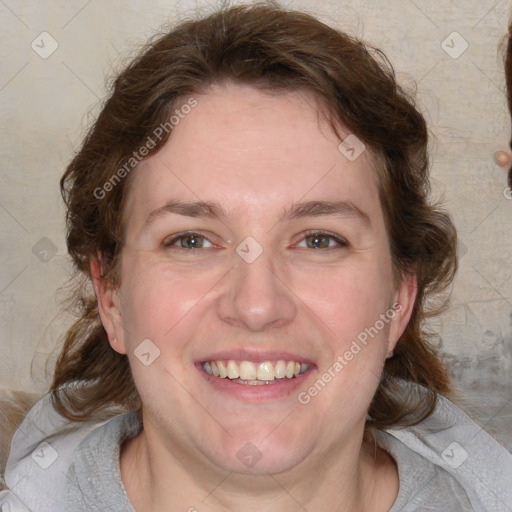 Joyful white adult female with medium  brown hair and blue eyes