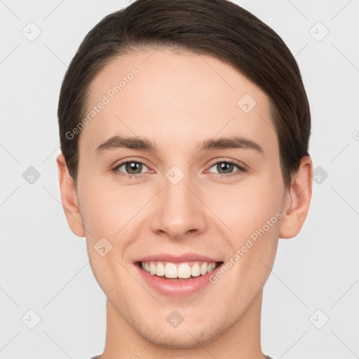 Joyful white young-adult female with short  brown hair and brown eyes