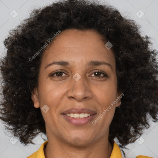 Joyful black adult female with short  brown hair and brown eyes