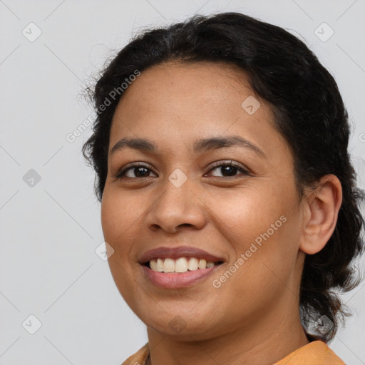 Joyful latino young-adult female with medium  brown hair and brown eyes