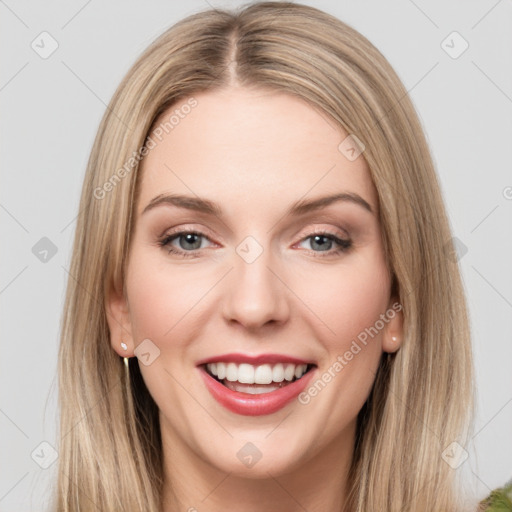 Joyful white young-adult female with long  brown hair and green eyes