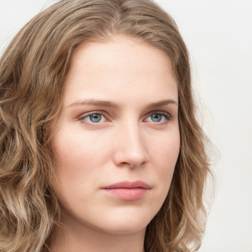 Neutral white young-adult female with long  brown hair and green eyes