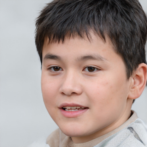 Joyful white child male with short  brown hair and brown eyes