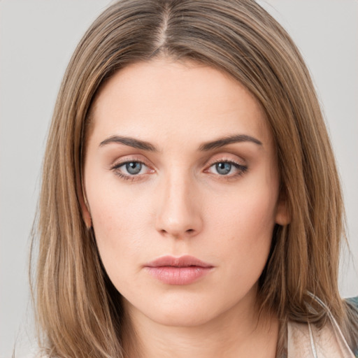 Neutral white young-adult female with long  brown hair and brown eyes