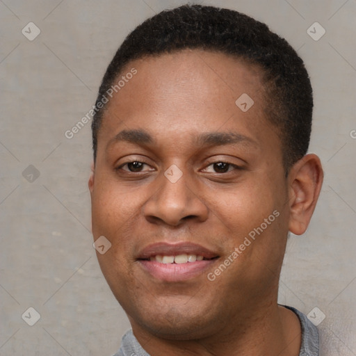 Joyful black young-adult male with short  brown hair and brown eyes