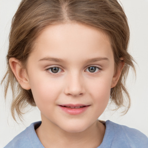 Joyful white child female with medium  brown hair and grey eyes