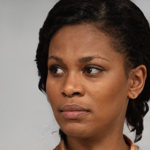 Neutral black young-adult female with short  black hair and brown eyes
