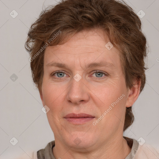 Joyful white adult female with short  brown hair and grey eyes