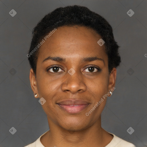 Joyful black young-adult female with short  black hair and brown eyes