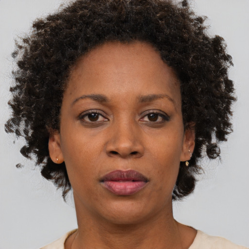 Neutral black adult female with short  brown hair and brown eyes