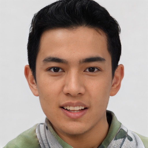Joyful white young-adult male with short  black hair and brown eyes