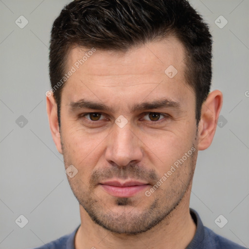 Joyful white young-adult male with short  brown hair and brown eyes