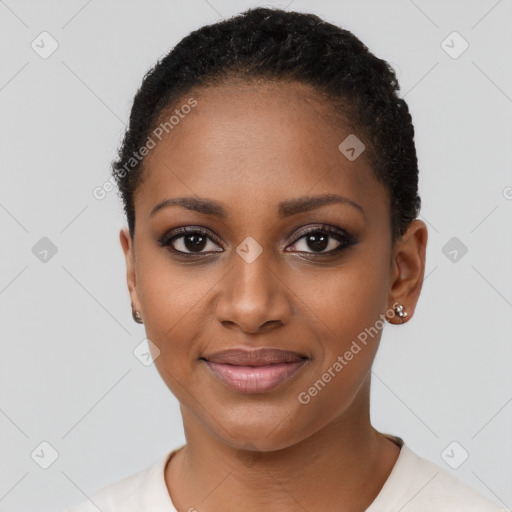 Joyful black young-adult female with short  black hair and brown eyes