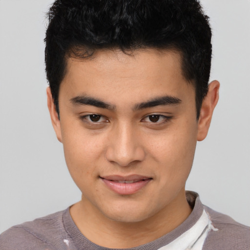 Joyful asian young-adult male with short  brown hair and brown eyes