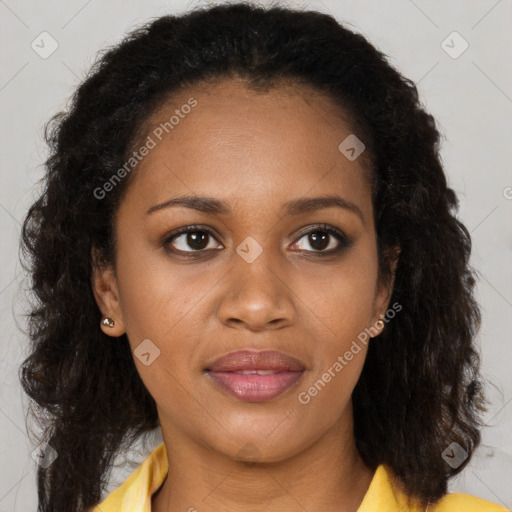 Joyful black young-adult female with long  brown hair and brown eyes