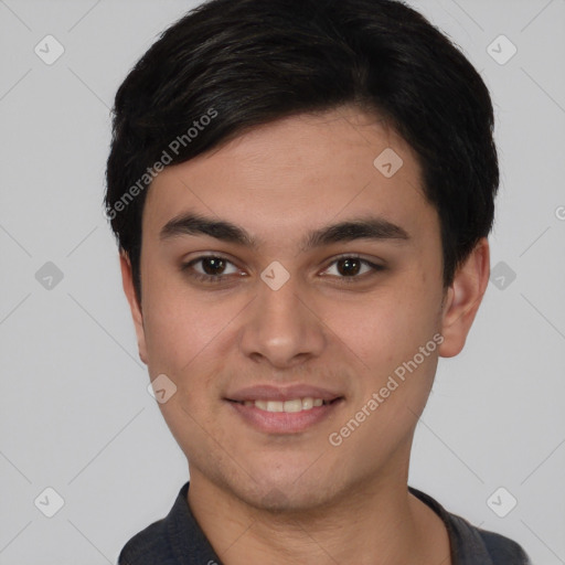 Joyful white young-adult male with short  black hair and brown eyes