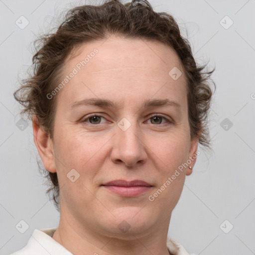 Joyful white adult female with short  brown hair and grey eyes