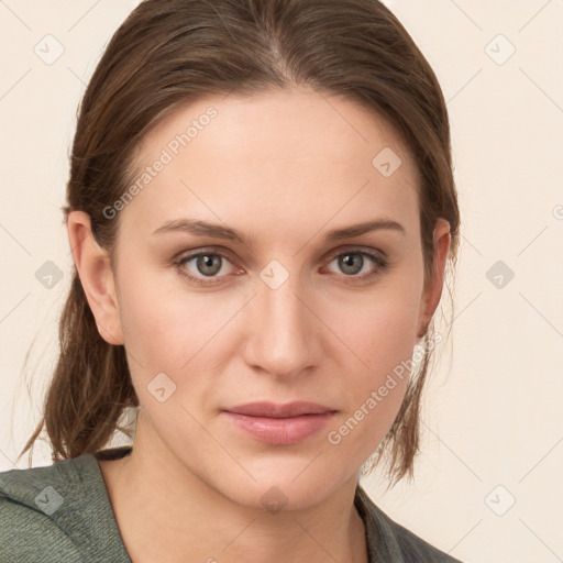 Joyful white young-adult female with medium  brown hair and grey eyes