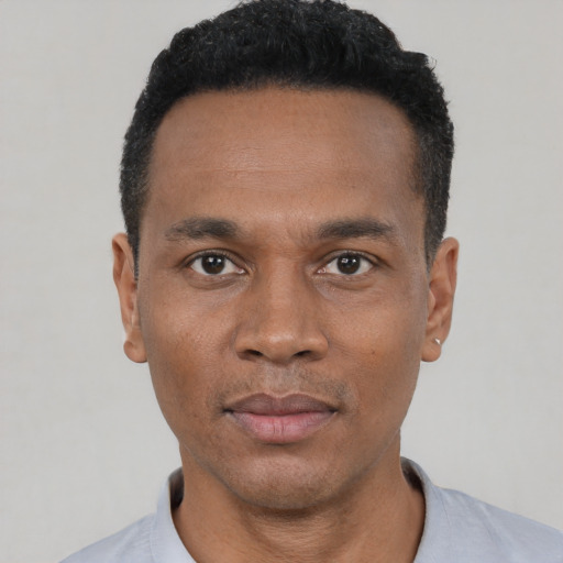 Neutral black young-adult male with short  black hair and brown eyes