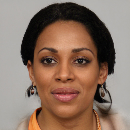 Joyful latino young-adult female with long  black hair and brown eyes