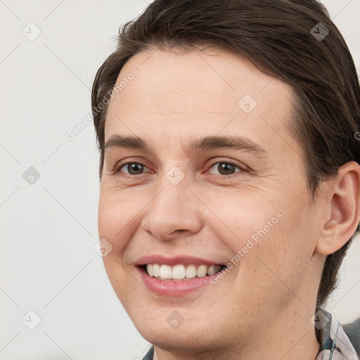 Joyful white young-adult male with medium  brown hair and brown eyes