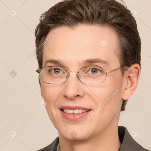 Joyful white adult male with short  brown hair and grey eyes