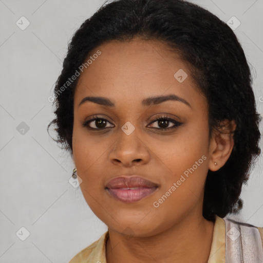 Joyful black young-adult female with long  black hair and brown eyes