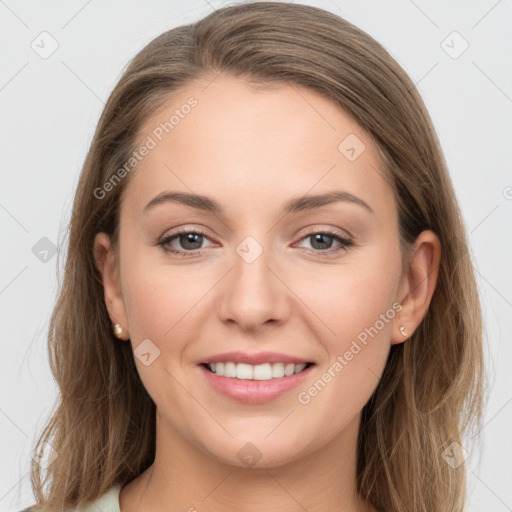 Joyful white young-adult female with long  brown hair and grey eyes