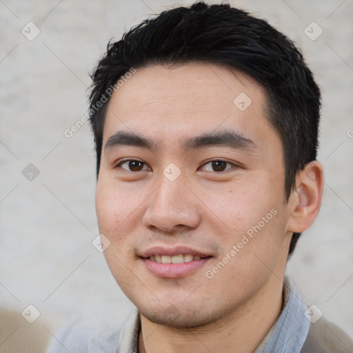 Joyful white young-adult male with short  black hair and brown eyes