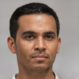 Neutral latino young-adult male with short  black hair and brown eyes