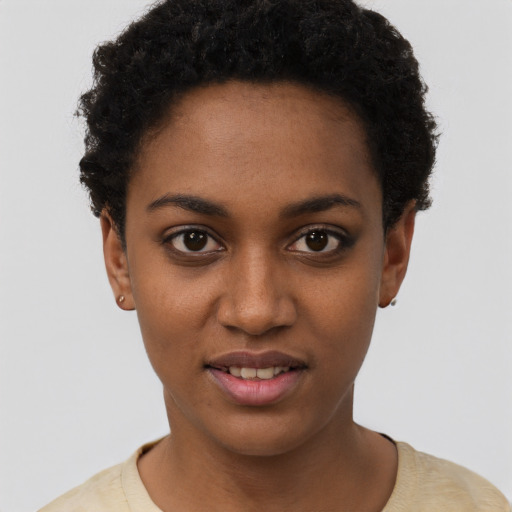 Joyful black young-adult female with short  brown hair and brown eyes