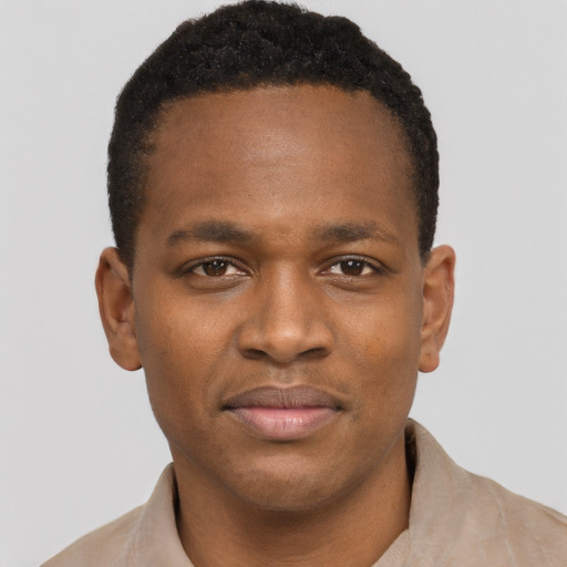 Joyful latino young-adult male with short  brown hair and brown eyes