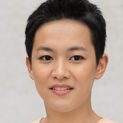 Joyful asian young-adult female with short  black hair and brown eyes