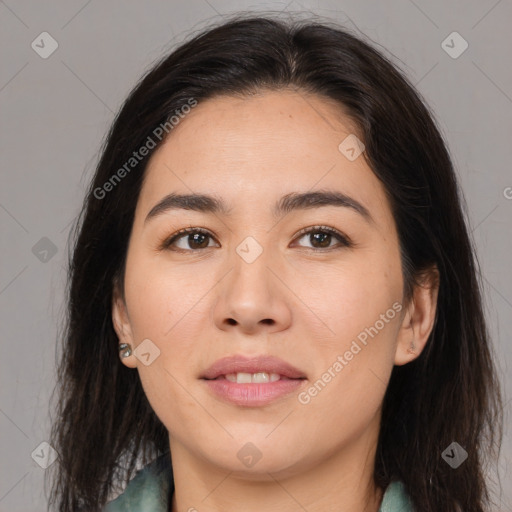 Joyful asian young-adult female with long  brown hair and brown eyes