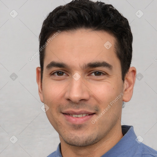 Joyful white young-adult male with short  black hair and brown eyes