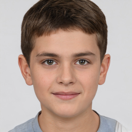 Joyful white child male with short  brown hair and brown eyes