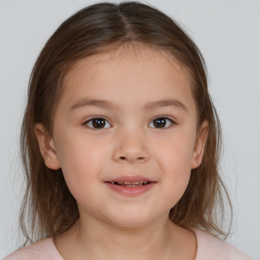 Joyful white child female with medium  brown hair and brown eyes